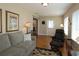 Relaxing living room with hardwood floors and neutral decor at 13709 Se 89Th Ave, Summerfield, FL 34491