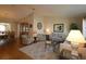 Bright and spacious living room with hardwood floors, neutral color palette, and comfortable seating at 13709 Se 89Th Ave, Summerfield, FL 34491
