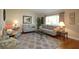 Living room featuring neutral decor, hardwood floors, and ample natural light at 13709 Se 89Th Ave, Summerfield, FL 34491