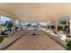 Covered patio with tables and chairs overlooking pool at 13709 Se 89Th Ave, Summerfield, FL 34491