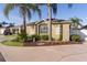 Single-story home with attached garage and lush landscaping at 1418 Mccoll Ct, The Villages, FL 32162