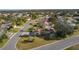 House nestled in a community with palm trees and well-maintained lawns at 1509 Lakewood Dr, The Villages, FL 32162