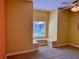 Bedroom with built-in window seat and ceiling fan at 1515 Gadsden Pl, The Villages, FL 32162
