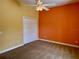 Spacious bedroom with neutral walls, ceiling fan, and large closet at 1515 Gadsden Pl, The Villages, FL 32162