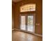 Bright entryway featuring tile flooring, double doors, transom window, and decorative hanging lighting at 1515 Gadsden Pl, The Villages, FL 32162