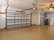 Large garage with ample space and an attic access at 1515 Gadsden Pl, The Villages, FL 32162