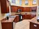 Spacious kitchen featuring stainless steel appliances, granite countertops, and wine rack at 1515 Gadsden Pl, The Villages, FL 32162