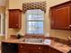 Kitchen features a window above the sink with views of the backyard at 1515 Gadsden Pl, The Villages, FL 32162