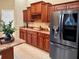 Modern kitchen boasts stainless steel appliances and extensive cabinetry at 1515 Gadsden Pl, The Villages, FL 32162