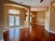 Bright and spacious living area with hardwood floors and French doors at 1515 Gadsden Pl, The Villages, FL 32162