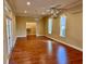 Large main bedroom with hardwood floors, high ceilings and two ceiling fans at 1515 Gadsden Pl, The Villages, FL 32162