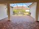 Screened patio with brick flooring, ideal for outdoor relaxation at 1515 Gadsden Pl, The Villages, FL 32162