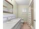 Bathroom featuring a single sink vanity and a shower with a curtain, and tile flooring at 17664 Se 105Th Terrace, Summerfield, FL 34491