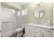 Updated bathroom features a shower, toilet and vanity with a marble countertop at 17664 Se 105Th Terrace, Summerfield, FL 34491