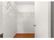 Walk in closet features wood floors and metal storage shelves at 17664 Se 105Th Terrace, Summerfield, FL 34491