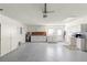 Garage space includes laundry area, storage cabinets and room for vehicles at 17664 Se 105Th Terrace, Summerfield, FL 34491