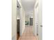 Hallway view showcasing neutral-toned walls and tile flooring leading to other rooms in the house at 17664 Se 105Th Terrace, Summerfield, FL 34491