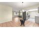 Open concept kitchen with stainless steel appliances, white cabinetry, and views of the living area, perfect for entertaining at 17664 Se 105Th Terrace, Summerfield, FL 34491
