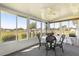 Sunroom features many windows with views of the outside at 17664 Se 105Th Terrace, Summerfield, FL 34491