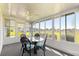 Sunroom features many windows with views of the outside at 17664 Se 105Th Terrace, Summerfield, FL 34491