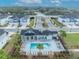 Aerial view of a community pool area with lounge chairs and lush greenery at 1819 Terrapin Rd, Ocoee, FL 34761