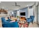 Living room with blue sofa and view into kitchen at 1819 Terrapin Rd, Ocoee, FL 34761