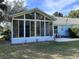 Bright sunroom addition with many windows at 1895 Country Club Blvd, Mount Dora, FL 32757