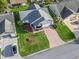 Aerial view of the house, showcasing landscaping and driveway at 2005 Palo Alto Ave, Lady Lake, FL 32159