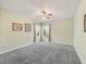 Spacious bedroom with gray carpeting and ceiling fan at 2005 Palo Alto Ave, The Villages, FL 32159