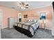 Main bedroom with carpeted floors and a ceiling fan at 2005 Palo Alto Ave, The Villages, FL 32159