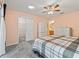 Main bedroom with walk-in closet and ceiling fan at 2005 Palo Alto Ave, The Villages, FL 32159