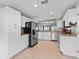Bright kitchen, featuring stainless steel appliances and white cabinetry at 2005 Palo Alto Ave, The Villages, FL 32159