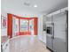 Bright kitchen nook with tiled floor and stainless steel appliances at 2005 Palo Alto Ave, The Villages, FL 32159