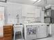 Laundry room with washer, dryer, and utility sink at 2005 Palo Alto Ave, The Villages, FL 32159