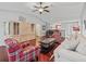 Living room with hardwood floors, and a large entertainment center at 2005 Palo Alto Ave, The Villages, FL 32159