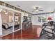 Relaxing sunroom with hardwood floors, leather recliners, and a fireplace at 2005 Palo Alto Ave, The Villages, FL 32159