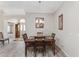 Formal dining room with wooden table and chandelier at 2402 Bennettsville Ln, The Villages, FL 32162