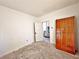 Unfinished bedroom with wood flooring and a closet at 248 E Magnolia St, Groveland, FL 34736