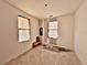 Unfinished bedroom with new windows and wood flooring at 248 E Magnolia St, Groveland, FL 34736