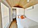 Cozy bedroom with a queen bed and access to the bathroom at 248 E Magnolia St, Groveland, FL 34736