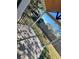 Wooden deck with black metal railing and backyard view at 248 E Magnolia St, Groveland, FL 34736