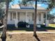 Charming craftsman style home with a metal roof and gray shutters at 248 E Magnolia St, Groveland, FL 34736