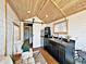 Modern galley kitchen with dark cabinets and wood details at 248 E Magnolia St, Groveland, FL 34736