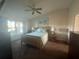 Bright bedroom with double bed, nightstands, and window views at 24825 Pine Hl, Leesburg, FL 34748