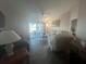 Spacious living room with access to a screened-in patio and a view of nature at 24825 Pine Hl, Leesburg, FL 34748