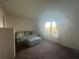 Cozy living room with sofa, ottoman, and large window offering scenic views at 24825 Pine Hl, Leesburg, FL 34748