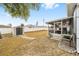 Spacious backyard with a storage shed, white fence and screened in patio area at 2555 Sw 154Th Place Rd, Ocala, FL 34473