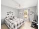 Bright bedroom with a queen-size bed and plenty of natural light at 2555 Sw 154Th Place Rd, Ocala, FL 34473