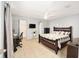 Spacious bedroom with a large bed, a home office area and walk-in closet at 2555 Sw 154Th Place Rd, Ocala, FL 34473