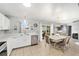 Bright dining area with tile floors, white cabinets and stainless steel dishwasher at 2555 Sw 154Th Place Rd, Ocala, FL 34473